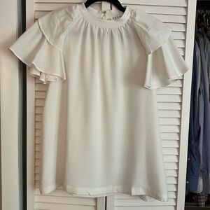 White blouse with ruffled sleeves